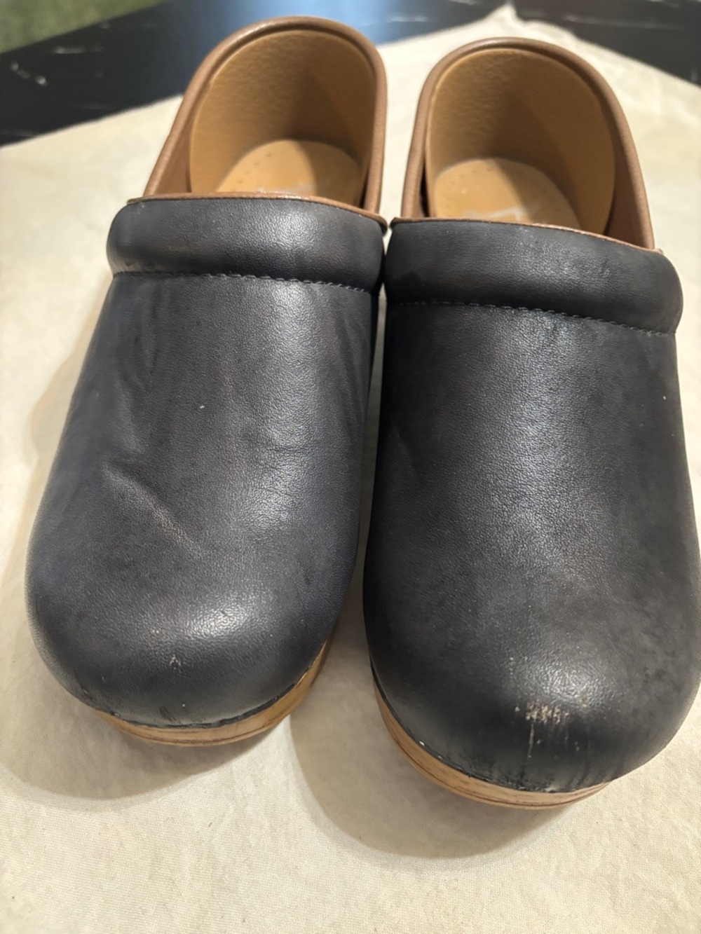 Dansko Black and Tan Leather Clogs